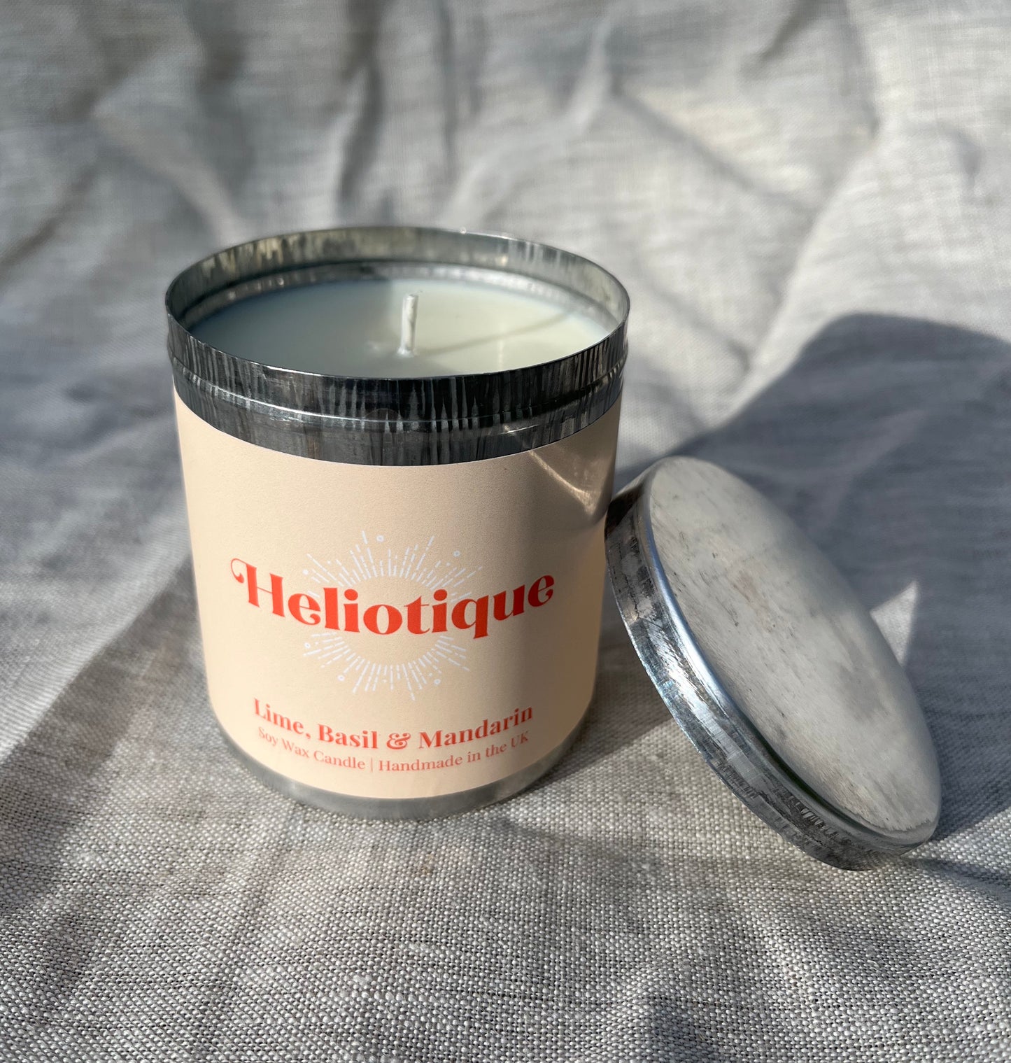 Heliotique | Heliotique Candle - Lime, Basil & Mandarin Tin Candle