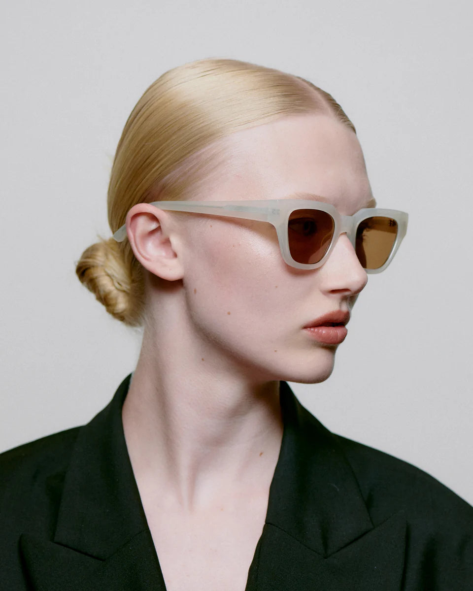 Heliotique Kaws Sunglasses - Cream Bone