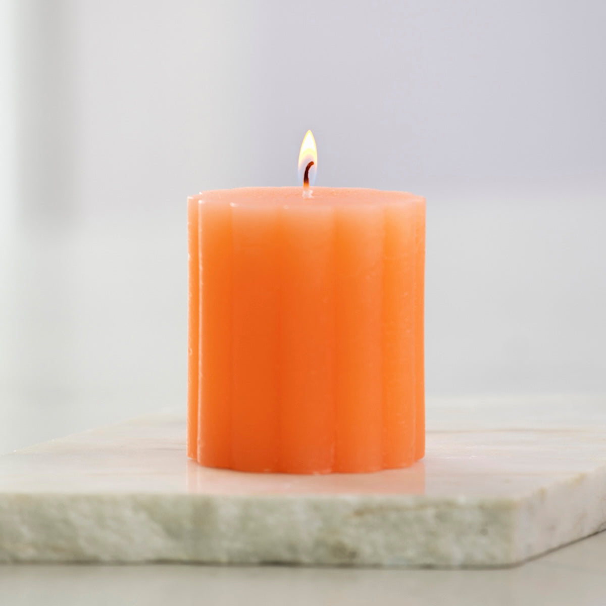 Heliotique | Grand Illusions Rustic Scalloped Pillar Candle - Coral
