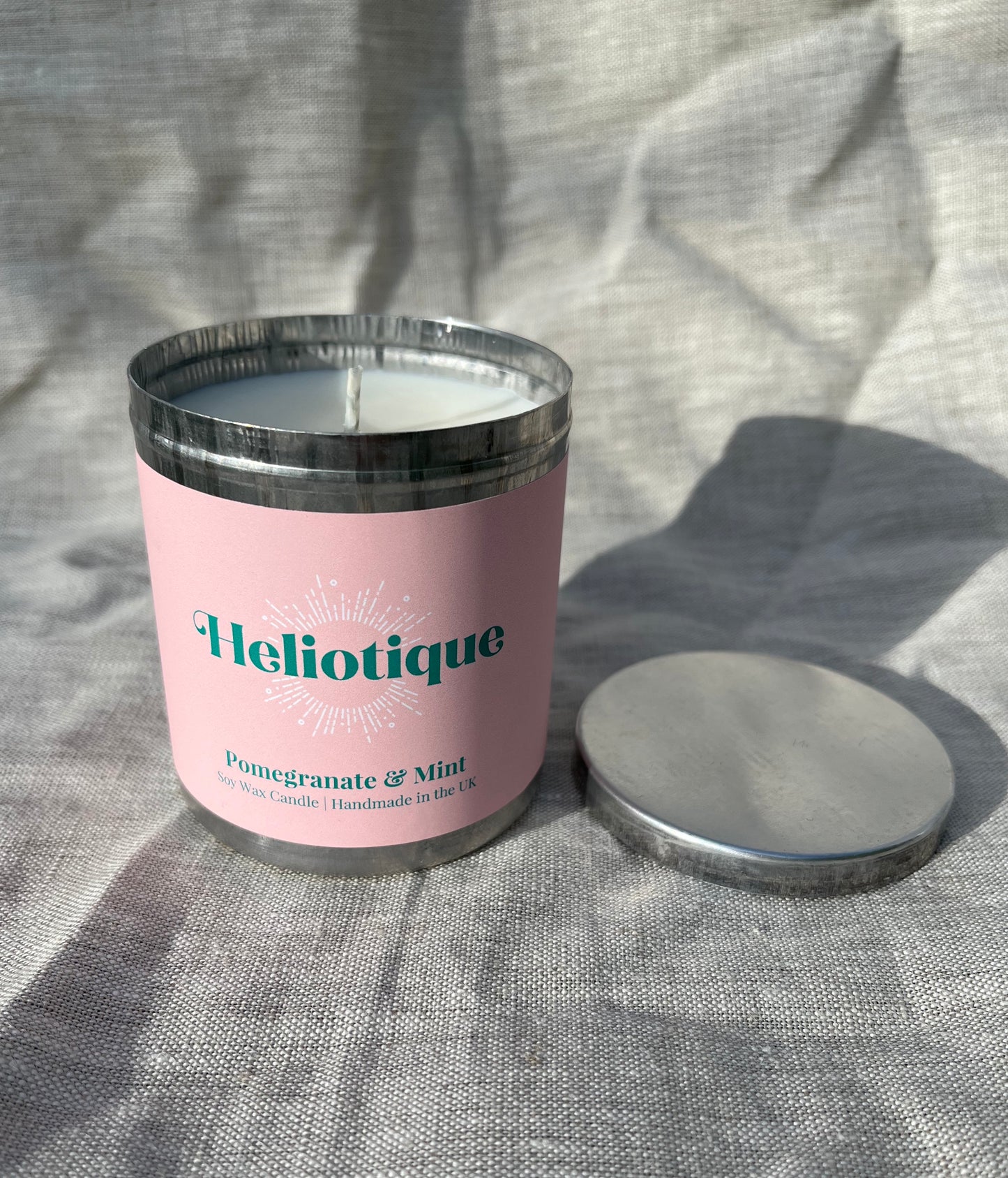 Heliotique | Heliotique Candle - Pomegranate & Mint Scented Tin Candle