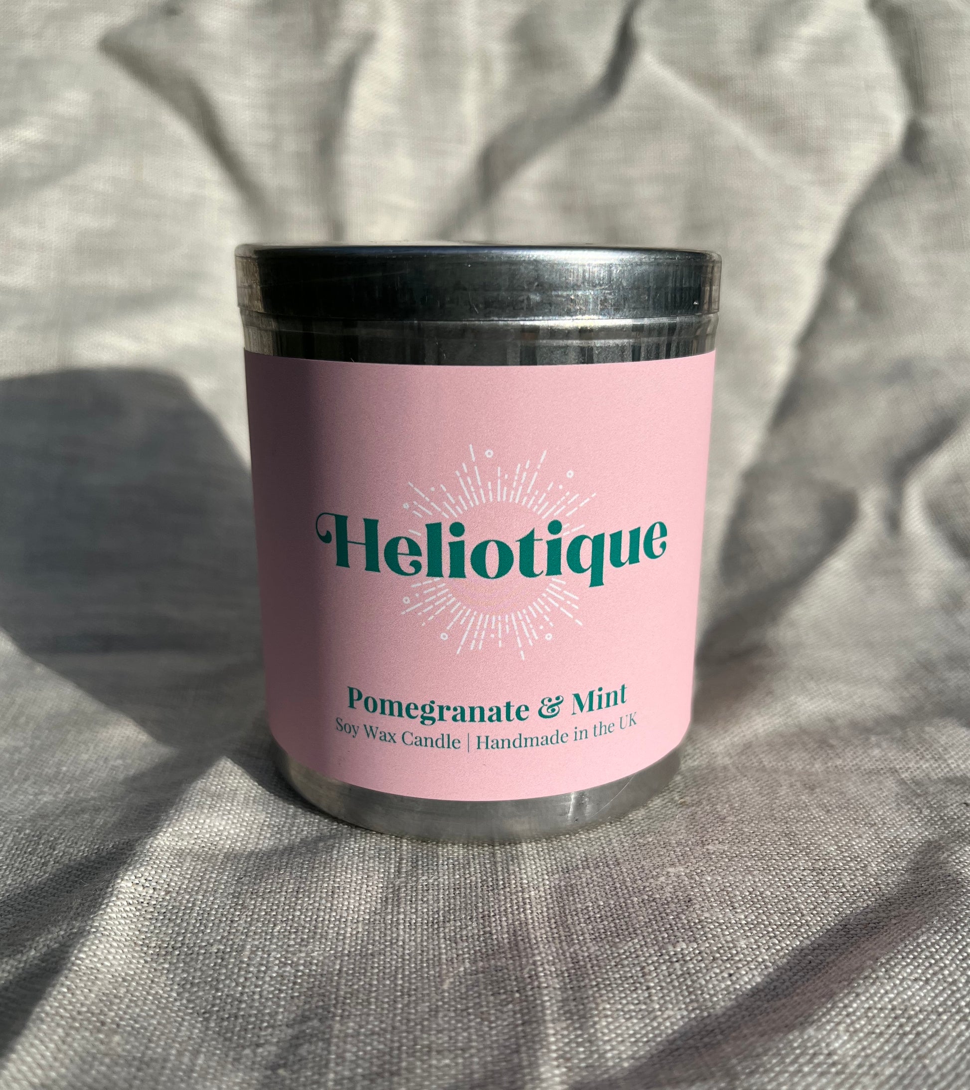 Heliotique | Heliotique Candle - Pomegranate & Mint Scented Tin Candle