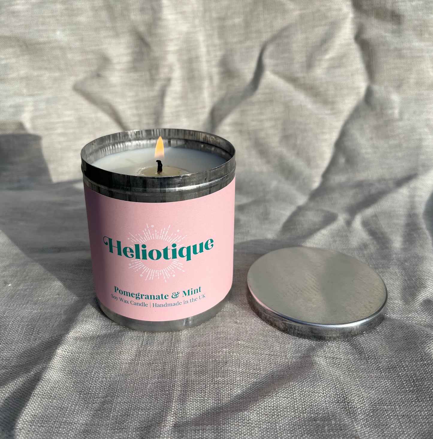 Heliotique | Heliotique Candle - Pomegranate & Mint Scented Tin Candle